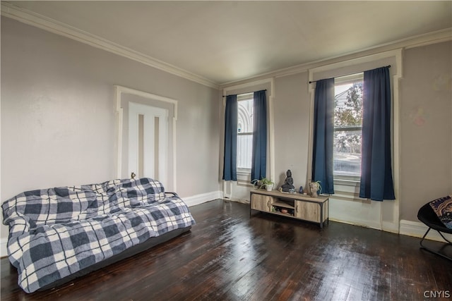 bedroom with ornamental molding and dark wood-type flooring