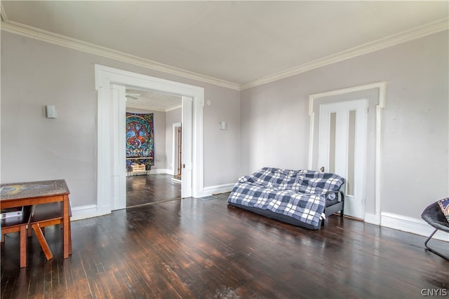 living area featuring dark hardwood / wood-style floors and ornamental molding