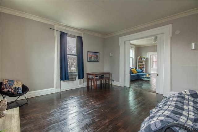 living room featuring dark wood-type flooring and ornamental molding