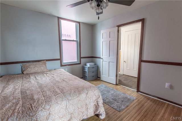 bedroom featuring ceiling fan and light wood-type flooring