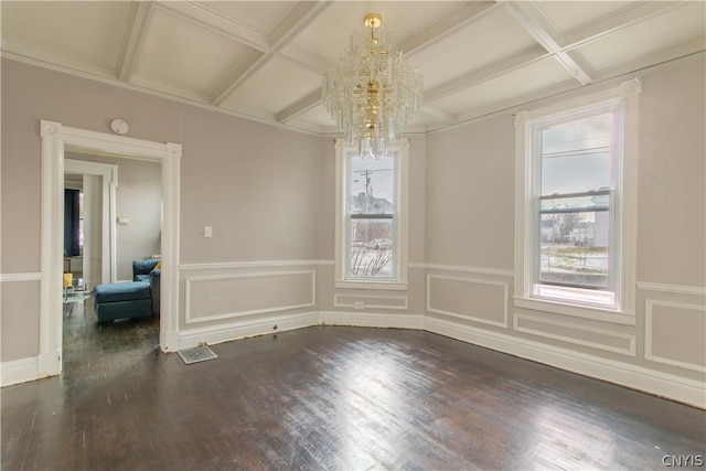 unfurnished room featuring dark hardwood / wood-style flooring, plenty of natural light, and coffered ceiling