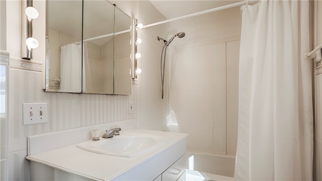 bathroom featuring vanity and shower / tub combo