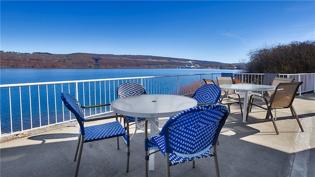 balcony with a water and mountain view