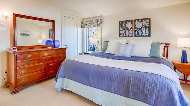 bedroom featuring light colored carpet