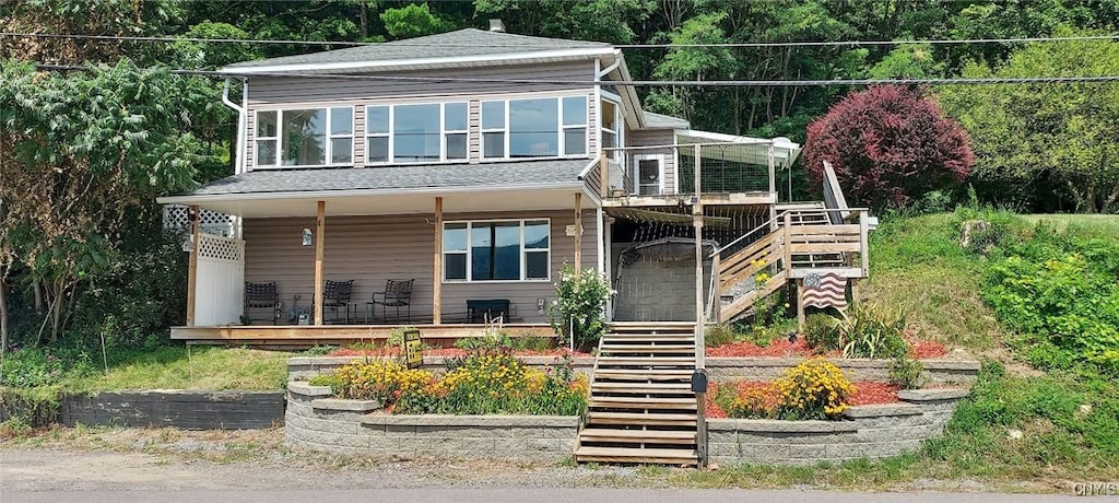 1742 Otisco Valley Rd, Otisco, NY 13110 - view of front of property featuring a porch, roof with shingles, and stairs