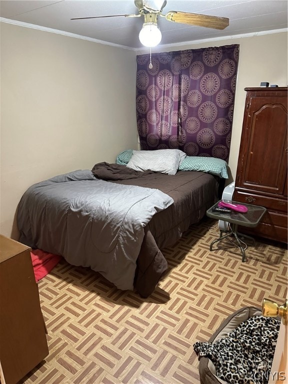 bedroom with ceiling fan, light parquet flooring, and ornamental molding