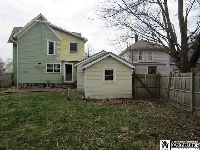 rear view of house with a lawn