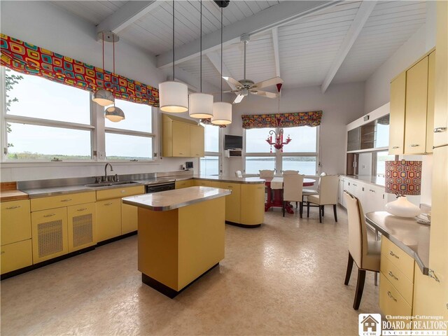 2 Elm Ln, Chautauqua, NY 14722 - kitchen with beamed ceiling, a sink, stainless steel countertops, a kitchen island, and a peninsula