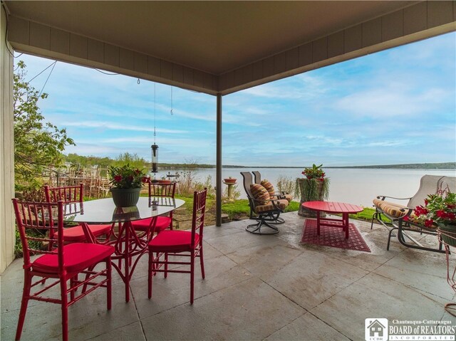2 Elm Ln, Chautauqua, NY 14722 - view of patio / terrace with outdoor dining space and a water view