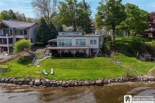 2 Elm Ln, Chautauqua, NY 14722 - rear view of house with stairway, a yard, and a deck with water view