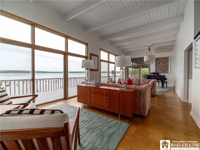 2 Elm Ln, Chautauqua, NY 14722 - living area with beamed ceiling, a water view, baseboards, and a wall unit AC