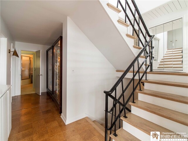 2 Elm Ln, Chautauqua, NY 14722 - stairway featuring tile patterned floors and baseboards