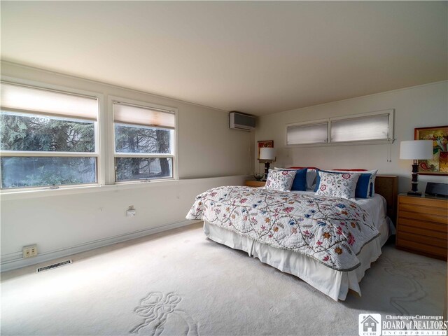 2 Elm Ln, Chautauqua, NY 14722 - bedroom featuring carpet, visible vents, and a wall mounted AC