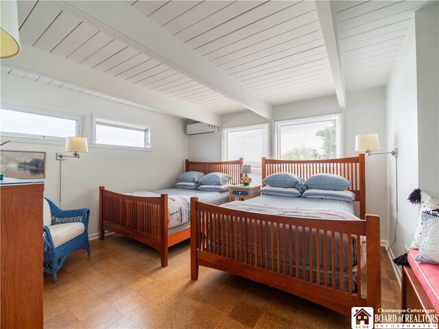 2 Elm Ln, Chautauqua, NY 14722 - bedroom with tile patterned floors, beam ceiling, a wall mounted air conditioner, and baseboards