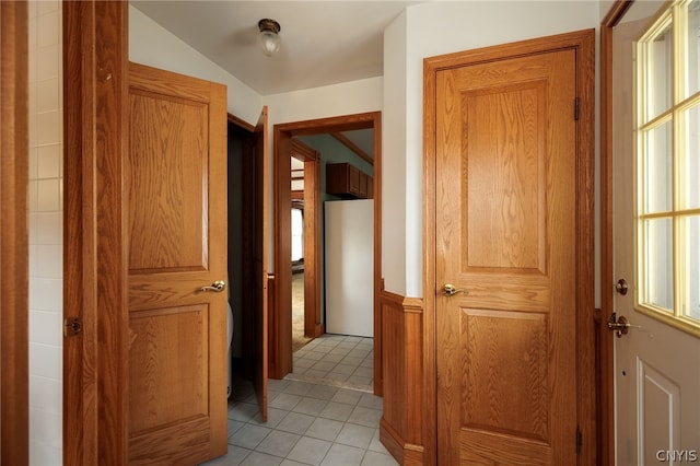 hallway with light tile patterned flooring