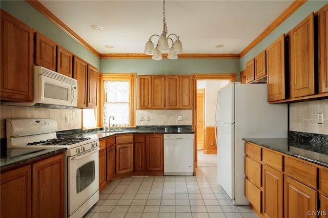 kitchen featuring ornamental molding, light tile patterned flooring, decorative light fixtures, an inviting chandelier, and white appliances