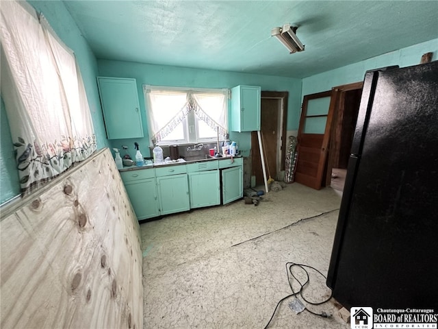 kitchen with black refrigerator