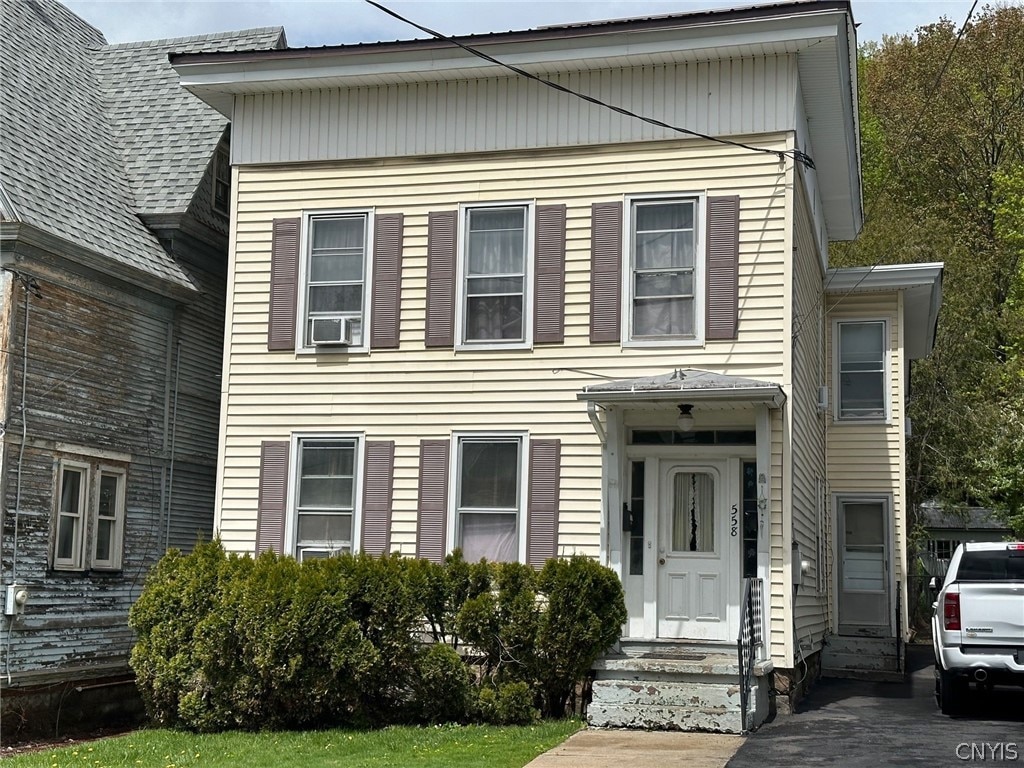 view of front of property featuring cooling unit