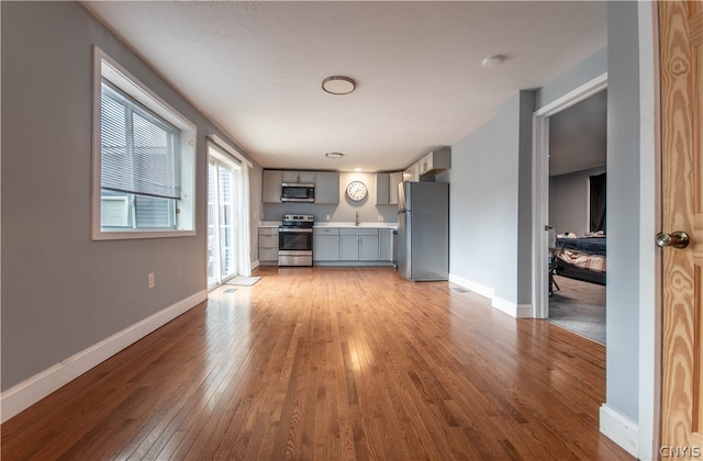 unfurnished living room with light wood-type flooring