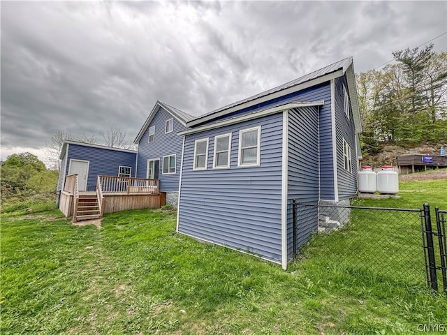 exterior space with a yard and a deck