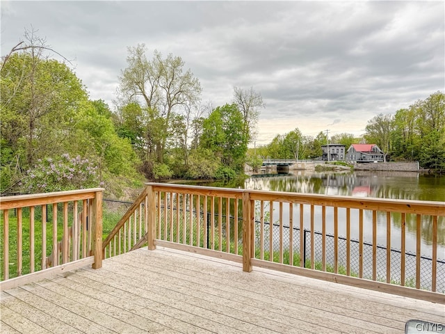 wooden terrace with a water view