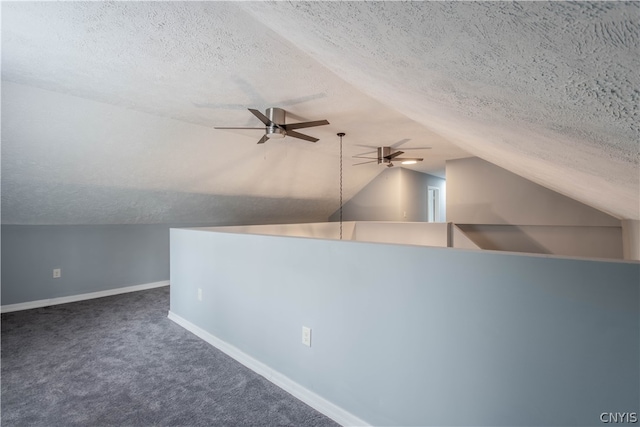 bonus room with ceiling fan, carpet floors, a textured ceiling, and lofted ceiling