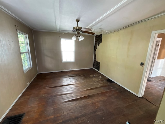 empty room with hardwood / wood-style floors and ceiling fan