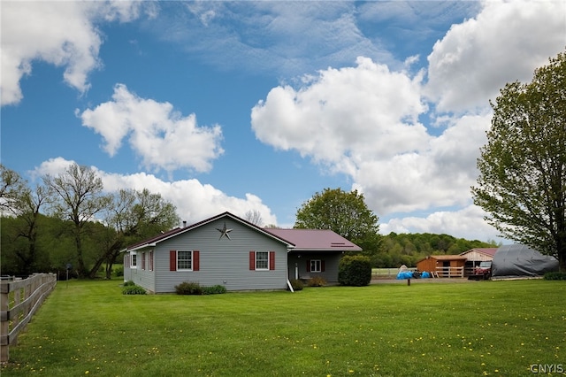 back of house with a yard