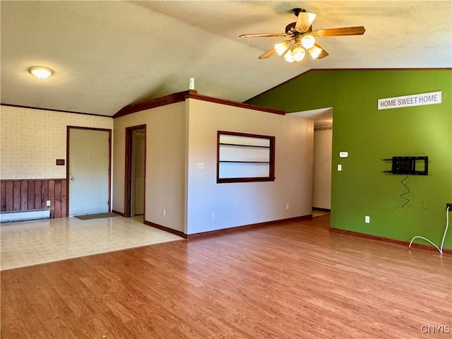 unfurnished living room featuring ceiling fan, a textured ceiling, light hardwood / wood-style floors, and vaulted ceiling