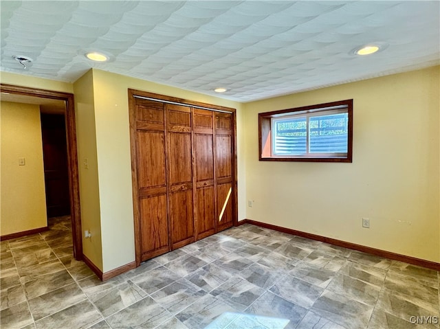 unfurnished bedroom featuring a closet