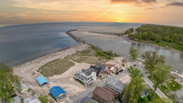 aerial view at dusk with a water view