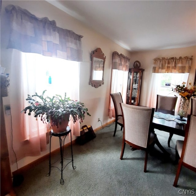 view of carpeted dining area