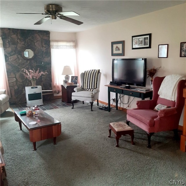 living room with carpet floors, heating unit, and ceiling fan