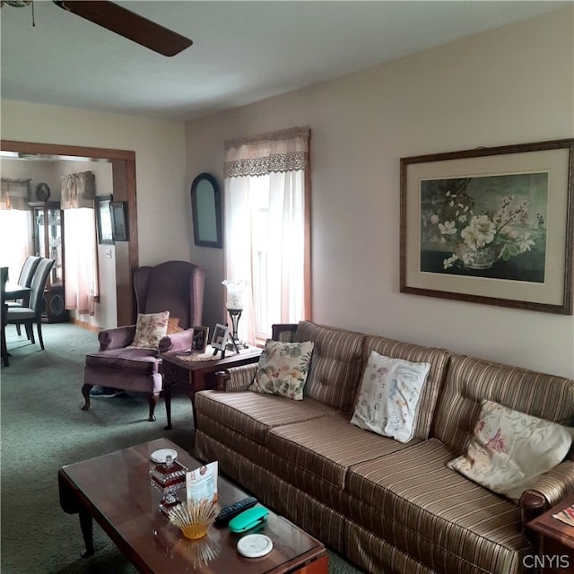 carpeted living room featuring ceiling fan