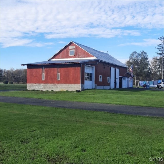 view of side of home with a lawn