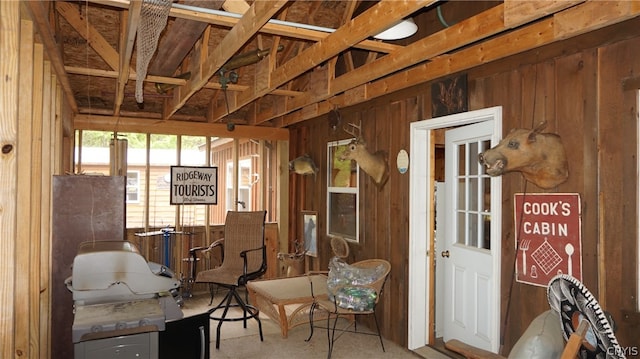 miscellaneous room with wood walls