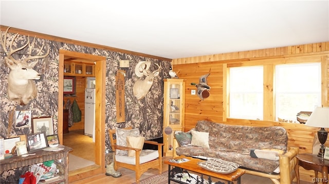 living room featuring wooden walls and wood-type flooring