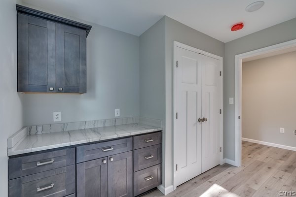 22217 Freedom Dr, Champion, NY 13619 - kitchen featuring light hardwood / wood-style floors and light stone countertops