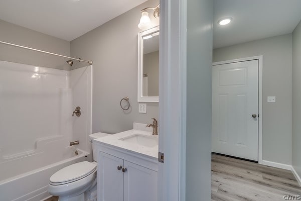 22217 Freedom Dr, Champion, NY 13619 - full bathroom featuring wood-type flooring, vanity, toilet, and shower / bathtub combination