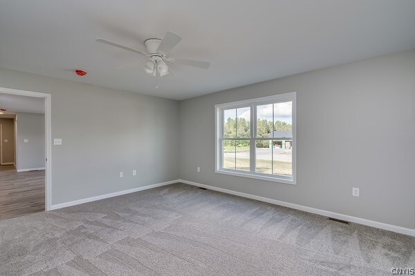 22217 Freedom Dr, Champion, NY 13619 - carpeted empty room with ceiling fan
