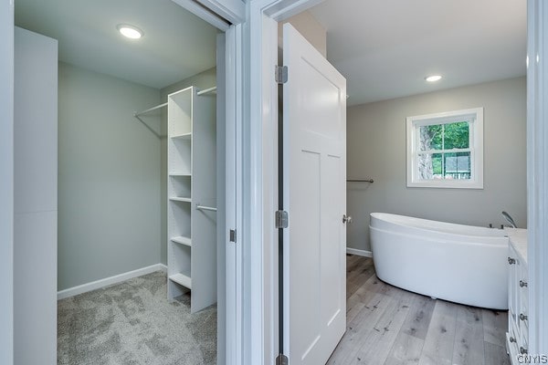 bathroom with hardwood / wood-style floors