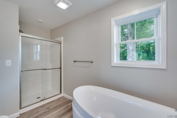 22217 Freedom Dr, Champion, NY 13619 - bathroom with a shower with shower door and hardwood / wood-style flooring