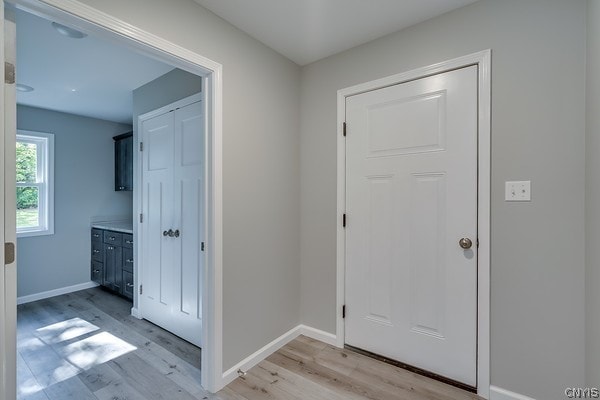 entryway with light hardwood / wood-style flooring