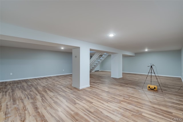 basement featuring light hardwood / wood-style floors