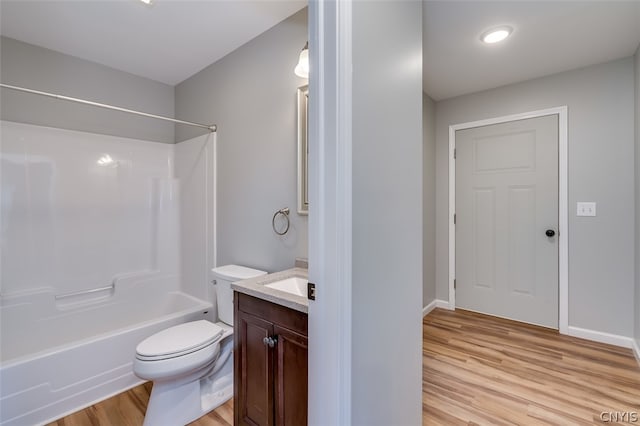 22217 Freedom Dr, Champion, NY 13619 - full bathroom featuring shower / tub combination, wood-type flooring, vanity, and toilet