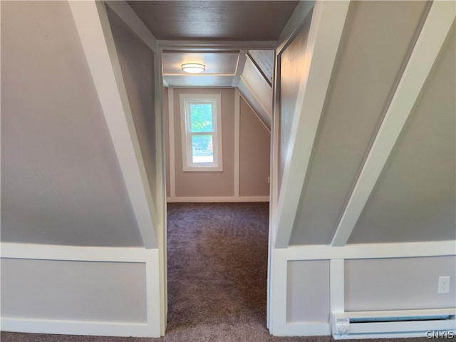 stairs with a baseboard radiator and dark carpet