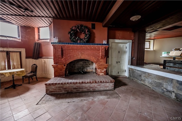 interior space featuring tile patterned floors and a brick fireplace