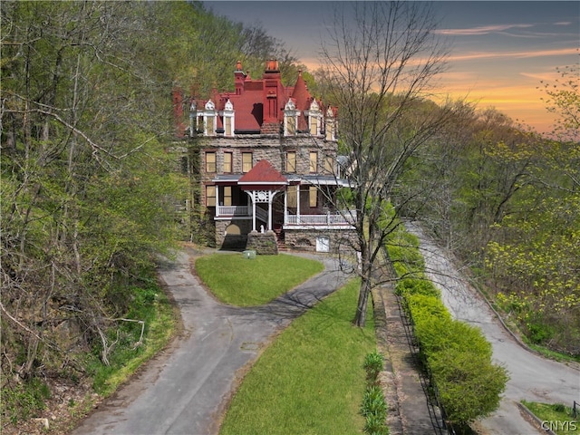 view of front of house featuring a yard and a porch