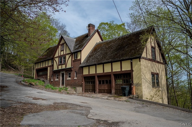 back of property with a garage