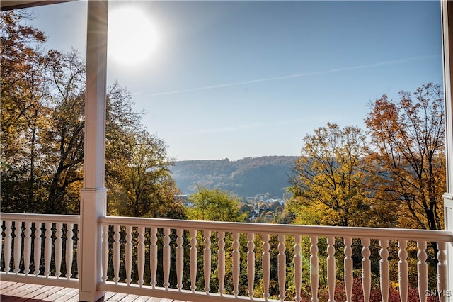 wooden terrace with a mountain view